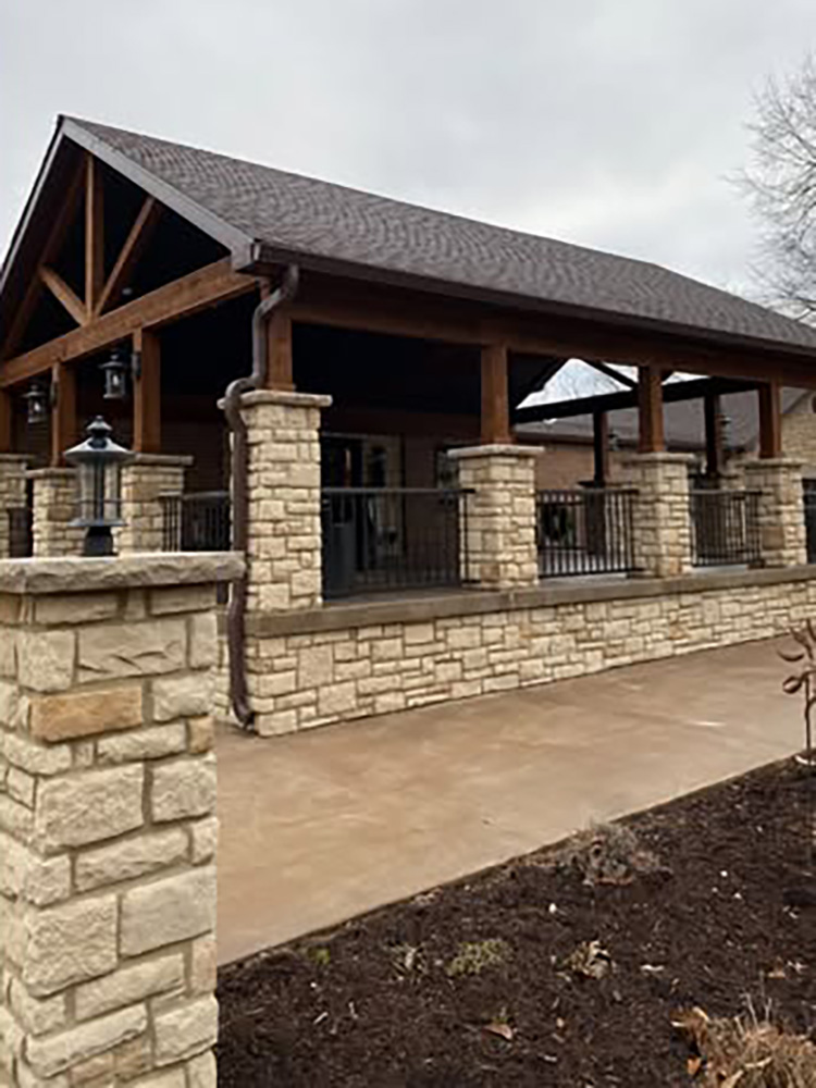 stone piers on stone wrapped porch
